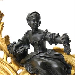 Pair of gilt metal Louis XIV style chenets, mounted with two bronze figures of a boy and girl, H29cm W30cm 