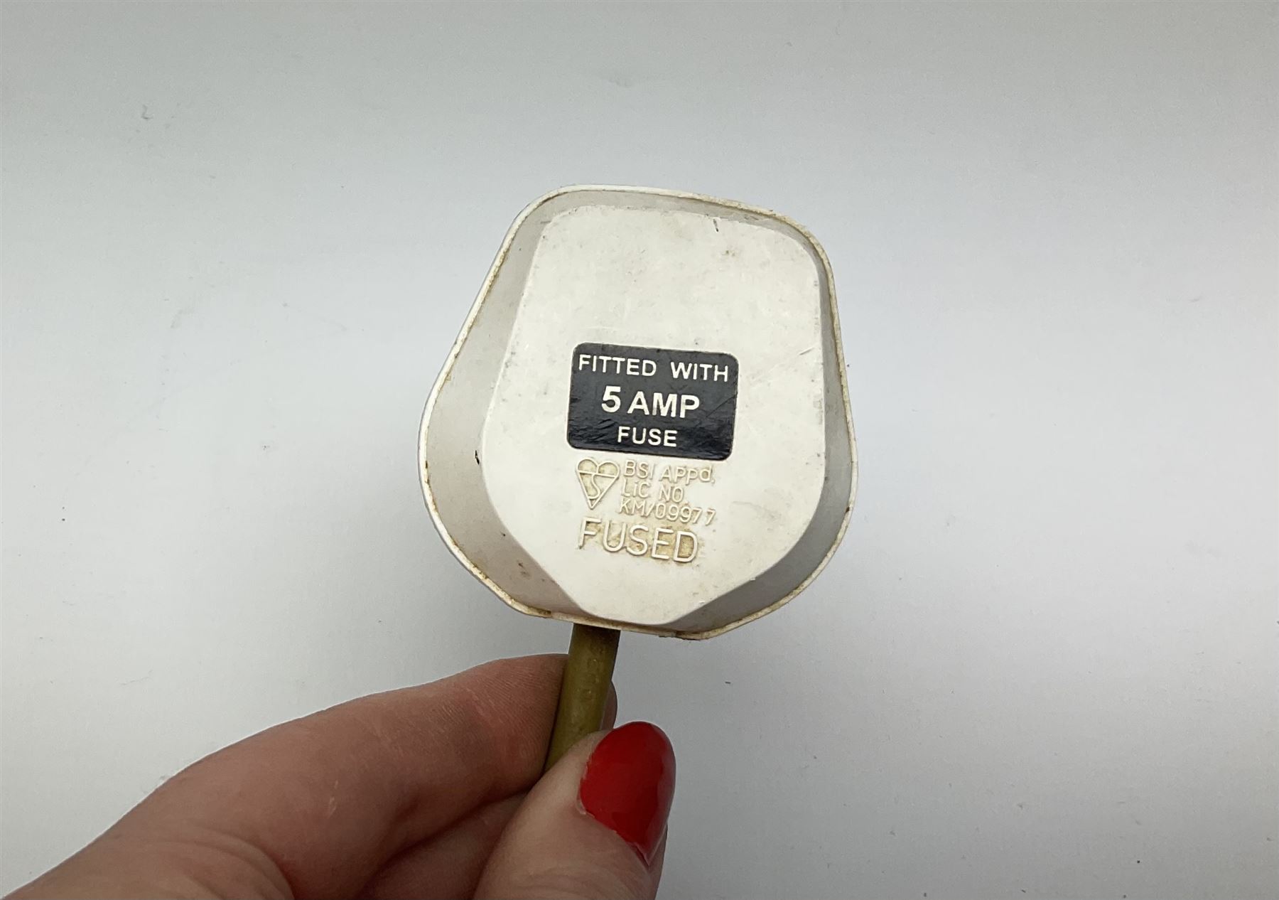 Pair Oriental table lamps decorated with birds in a tree with fruit, on a red ground with a gilded base together with cream lampshades H57cm, without lampshade. 