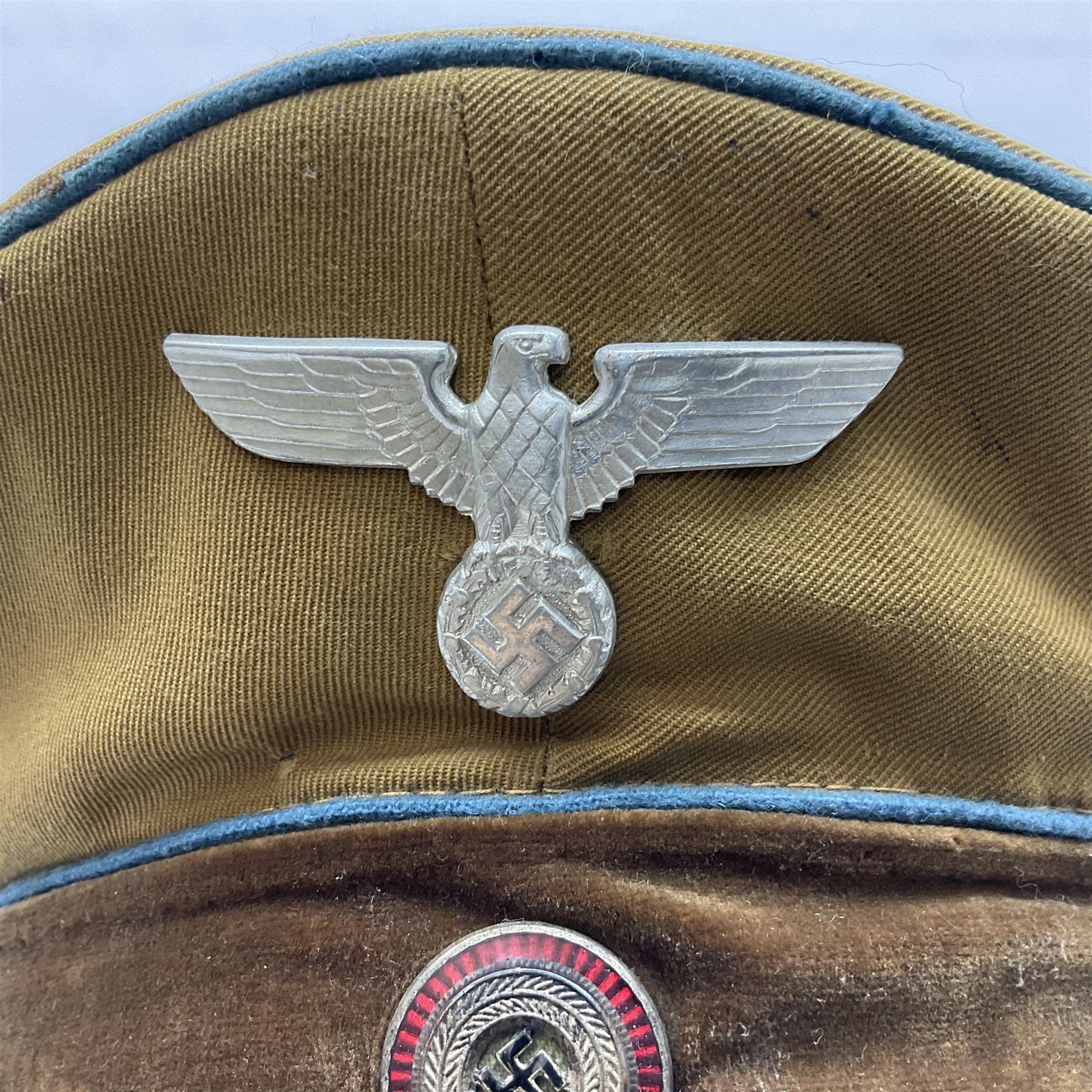WW2 German Political Leaders brown cloth visor cap with metal insignia; labelled K. Hartel Weiden