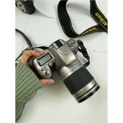 Collection of Nikon cameras, to include F60 serial no. 2574507, boxed, F70 serial no. 2807667, F75 serial no. 2062602, with an AF Nikkor 28-100mm 1:3.5-5.6 G lens serial no. 2166614, two F80 examples serial nos. 2553343 & 2777869, two F90X examples serial nos. 2209737 & 2438888, one boxed and an F100 serial no. 2051550
