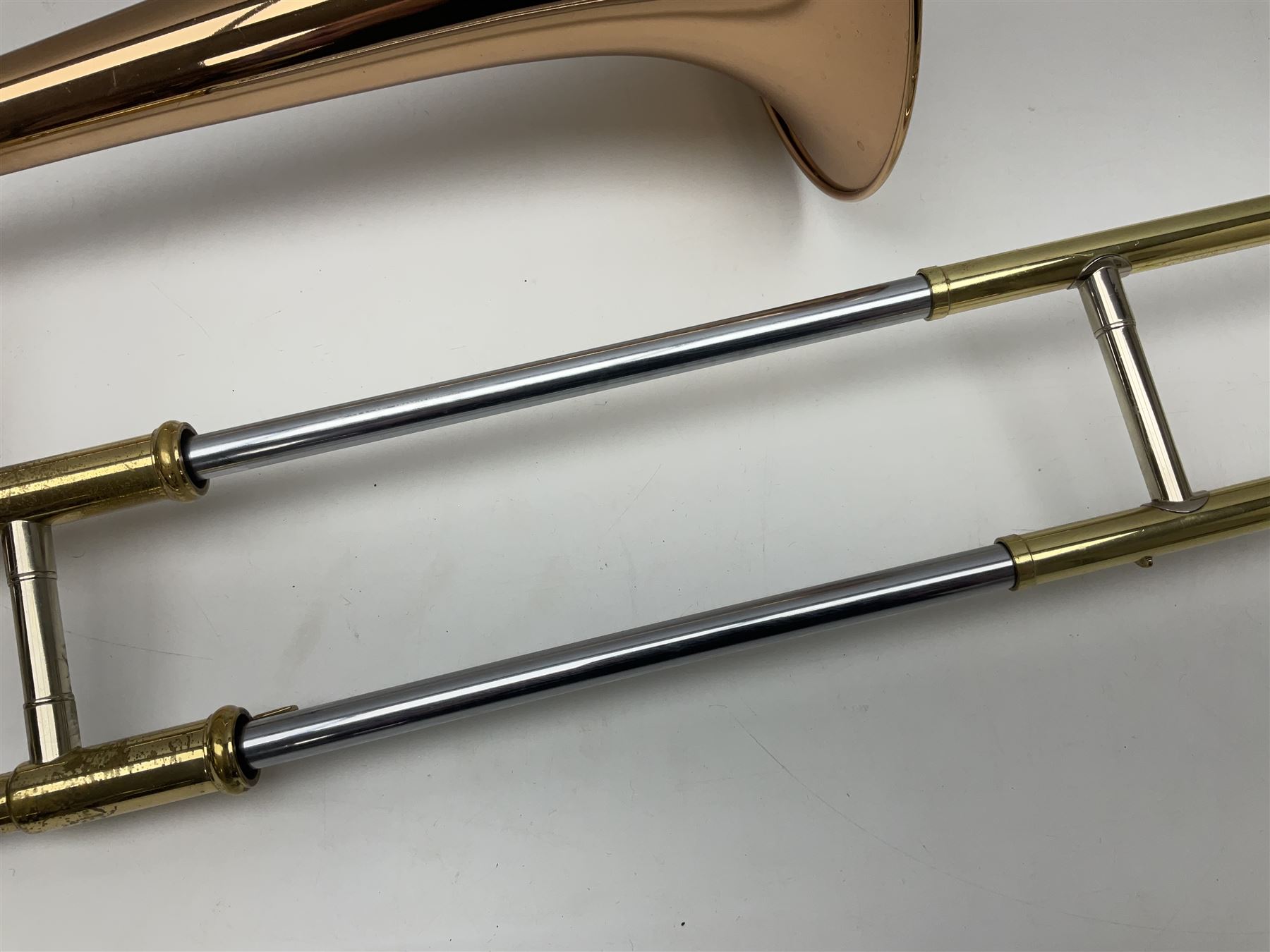 Sebastian Bucklet Aquae Sulis copper and brass trombone No.0910004; in lightweight carrying case; and Kinsman folding tubular chrome music stand in case (2)
