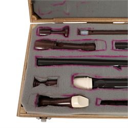 Three Dolmetsch recorders, comprising Dolmetsch International Tenor recorder, Dolmetsch Dolonite Treble recorder and a Dolmetsch International Descant recorder, all contained in a matched wooden case
