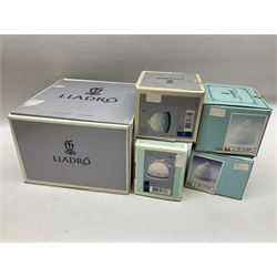 Lladro Segovia Clock no 5655, together with four Lladro bells, Autumn bell no 17615, Winter bell no 17616, Xmas bell 1988 no 15525 and Xmas bell 1989 no 15616, all with original boxes 