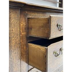 George III oak dresser, projecting dentil cornice over three heights plate rack enclosed by fluted uprights, the dresser fitted with five drawers and two panelled cupboards, canted corners with fluted quarter columns, on bracket feet