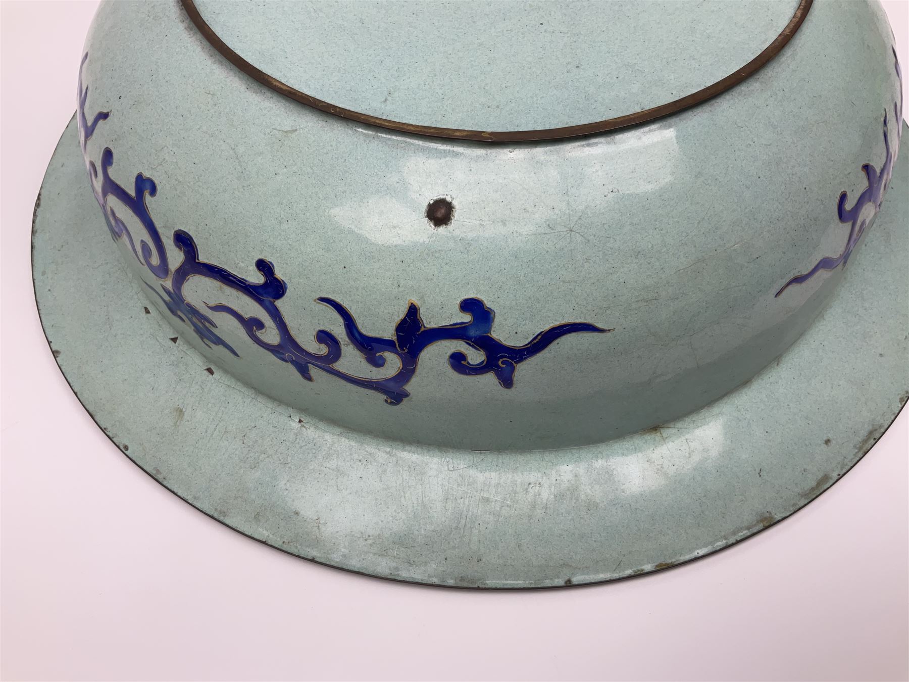 18th/19th century Chinese Canton enamel basin, the circular basin with flat everted rim, decorated with scrolling foliate and fruit decoration on a blue ground, D43cm
