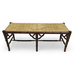 Faux bamboo long stool, stained beech frame with rectangular rush woven seat, rounded rail sides over ring-turned supports, united by side and end stretchers