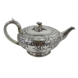 George III silver teapot, squat form, embossed foliate decoration, leaf-capped handle by John Emes, London 1807 with later flower finial by Henry Holland, hallmarked, approx 16.5oz
