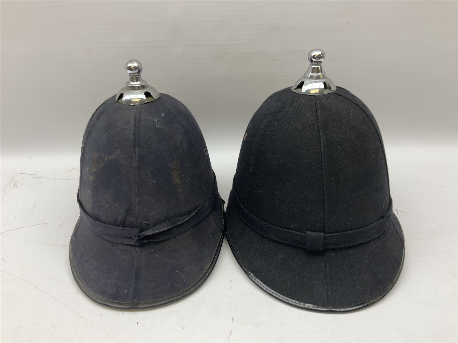Hull City Police - helmet with king's crown night plate; two further ball-top helmets with Queen's crown plates; and a peaked cap (4)