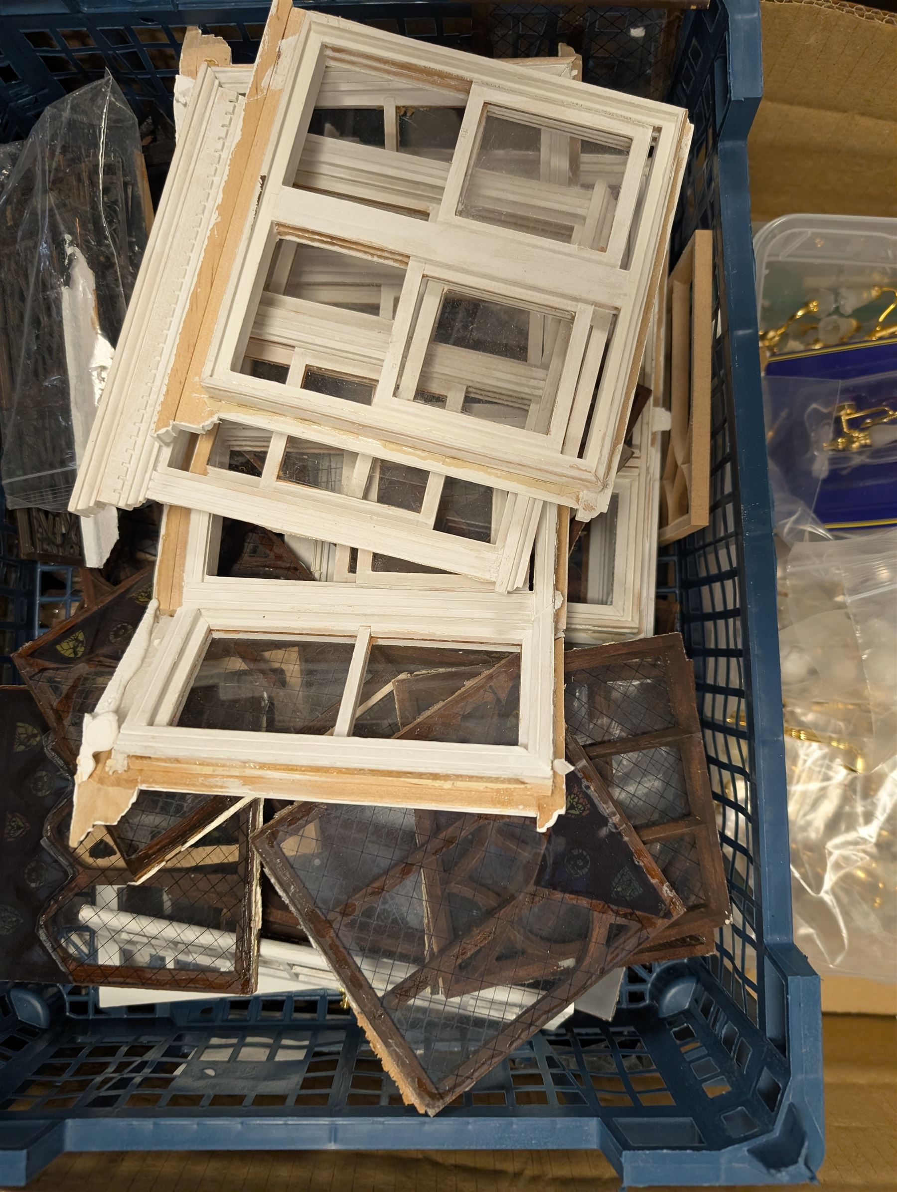 Dolls House building accessories, including three stair cases, a quantity of doors and windows, skirting board, coving, kitchen and fireplaces scenes and a collection of wired and non wired light fittings