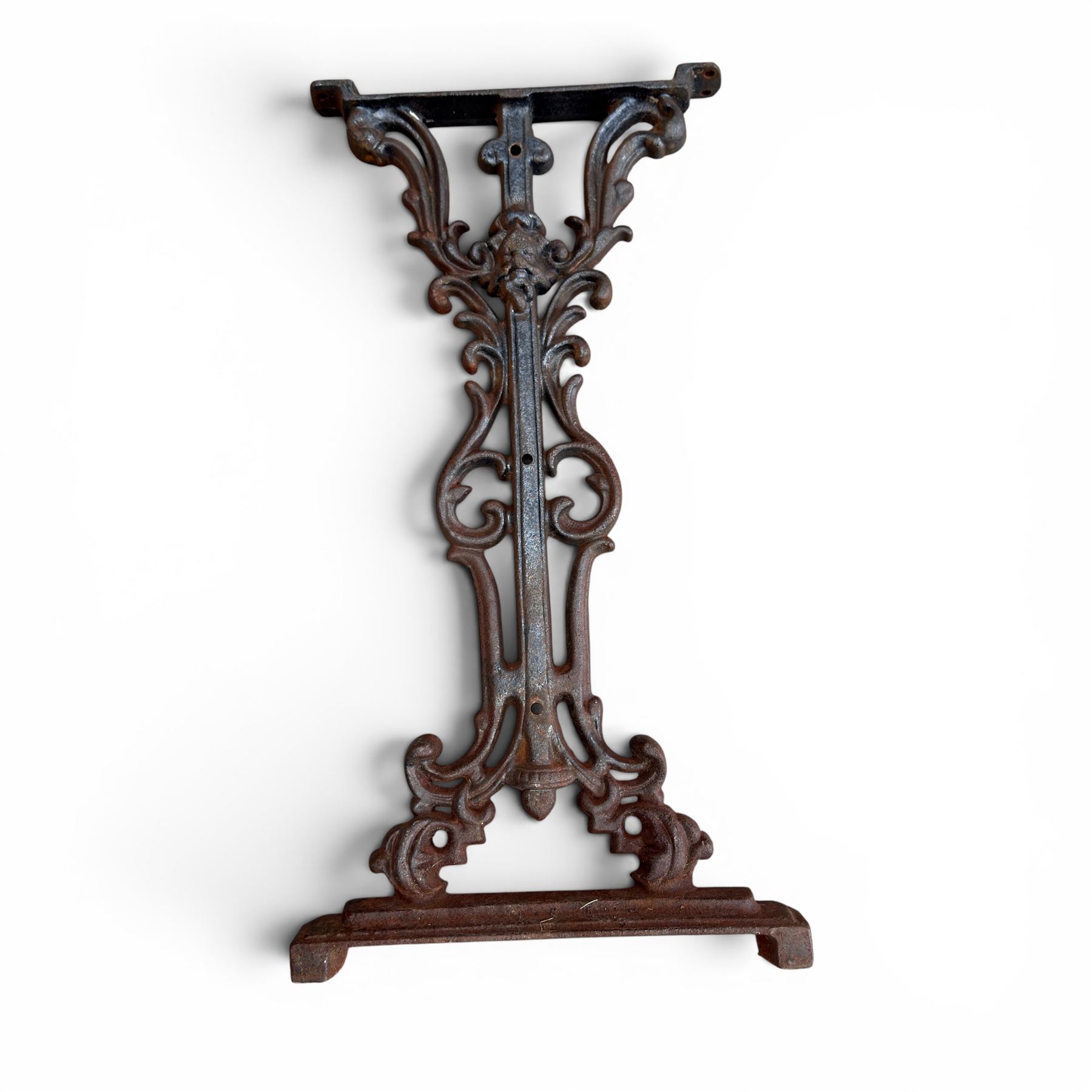 Pair of Victorian cast iron table end supports, of pierced and scrolling foliate design with central masks, united by X-form stretcher, with later top