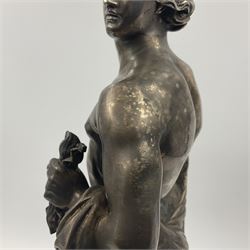 20th century silver plated figure, modelled as a classical male figure, possibly Prometheus, holding flames, one foot resting atop a small dragon, upon a circular spreading base, overall H37.5cm