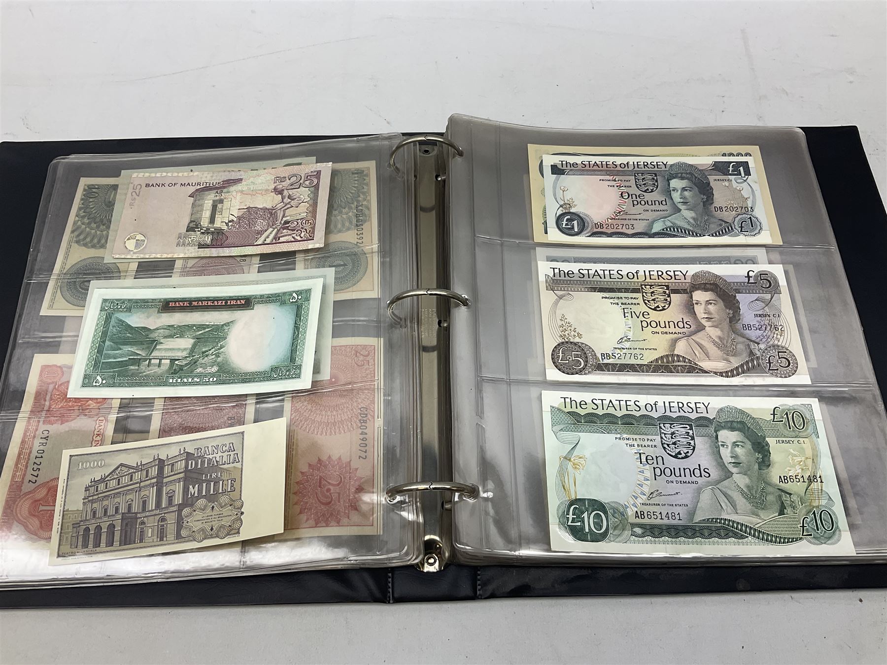 World banknotes, including Queen Elizabeth II The States of Jersey one pound 'DB202703', five pounds 'BB527762' and ten pounds 'AB651481', reserve bank of New Zealand two dollars '1L3 741894', King George V Straits Settlements one dollar 1st January 1935 'F/83 28924', various Bank of England notes etc, housed in two ring binder albums