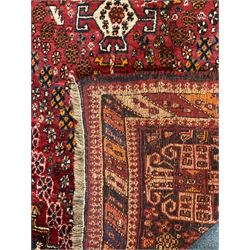 Persian red ground rug carpet, central diamond medallion, multicoloured chequered border