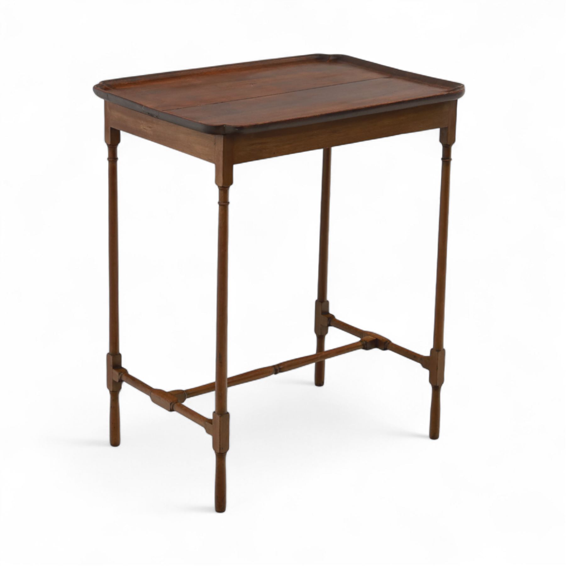 Early 20th century mahogany butler’s tray table, rectangular dished top with shaped corners, raised on turned faux bamboo legs with stretchers