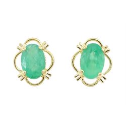 Pair of 9ct gold oval cut emerald stud earrings, stamped