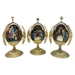 Franklin Mint House of Faberge three collectors eggs, comprising A king is born, We three kings, The flight into Egypt