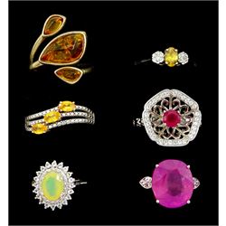 Six silver stone set rings including pink sapphire, opal and white topaz cluster, sphene and white zircon, amber and ruby and white zircon