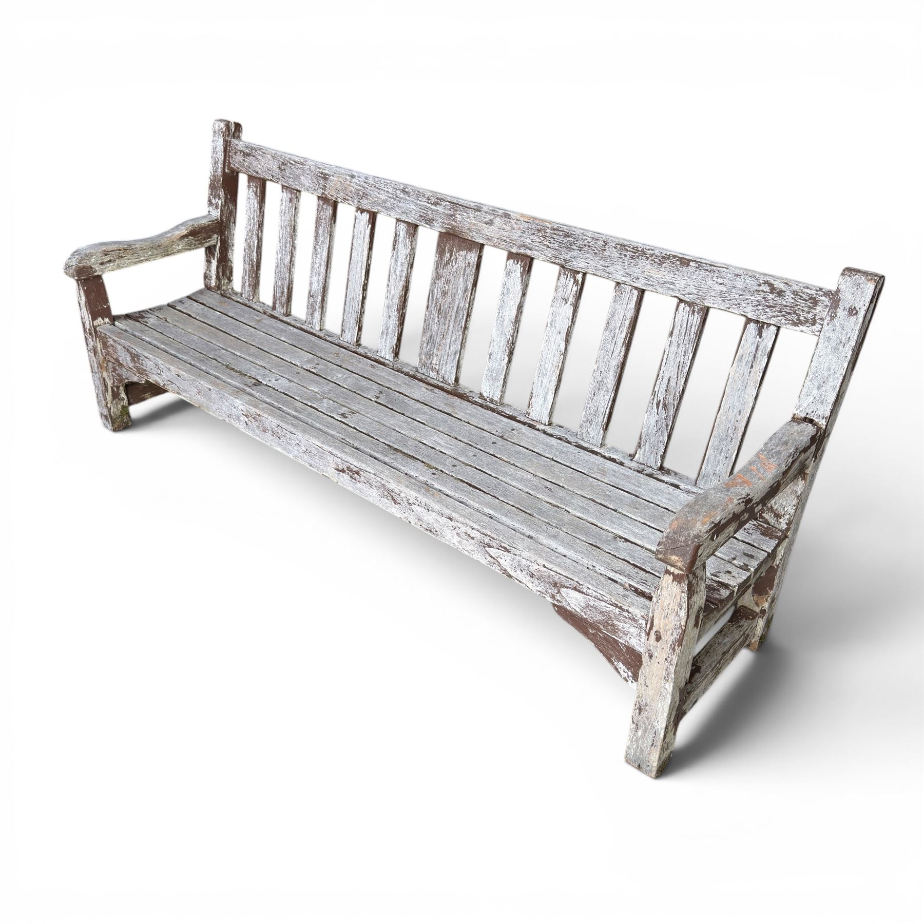 Teak garden bench with slatted back and seat on square supports in weathered which finish 