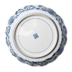 Pair of Japanese Edo period Ko Kutani dishes, decorated in green, yellow, blue iron-red, and aubergine enamels, the centres painted with a singing bird perched on a rock among foliage, within a border of alternating geometric designs and a chocolate-brown rim, the reverse with underglaze blue foliage, Fuku mark, D20.8cm (2) A matching pair of dishes is held in the collection of the Cleveland Museum of Art (see accession no. 1964.262)