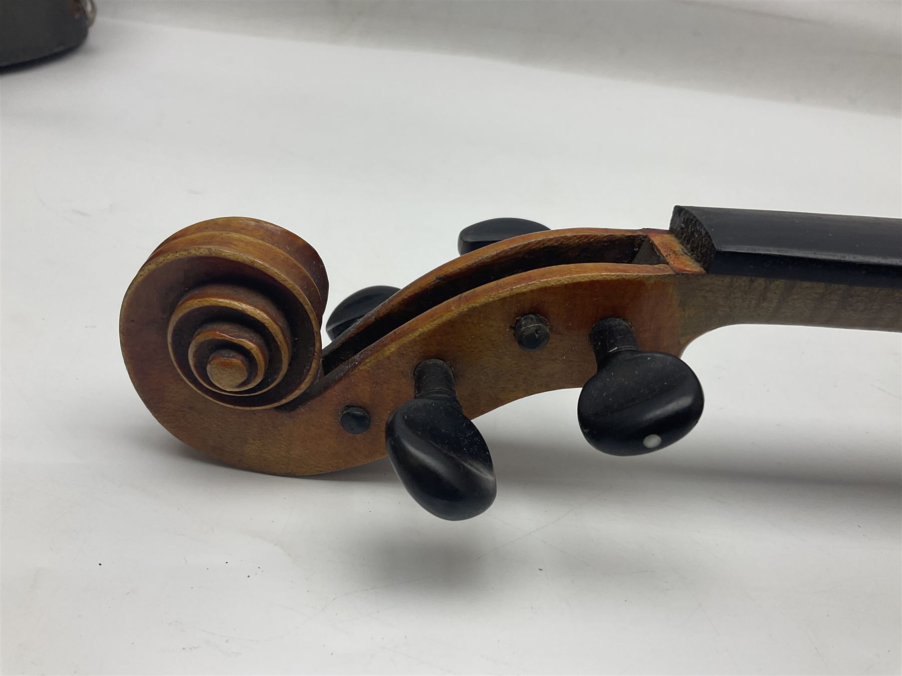 German trade violin c1900 copy of a Maggini with 36.5cm two-piece maple back and ribs and spruce top; double scroll; L60cm overall; in carrying case
