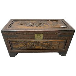 20th century carved camphor wood chest, rectangular hinged top enclosing removable tray and compartment, carved all-over with traditional pagoda scenes with figures