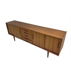 Nils Jonsson for Troeds - 'Gigant' mid-20th century teak sideboard, two double cupboards with sliding doors flanking five drawers, on tapering supports