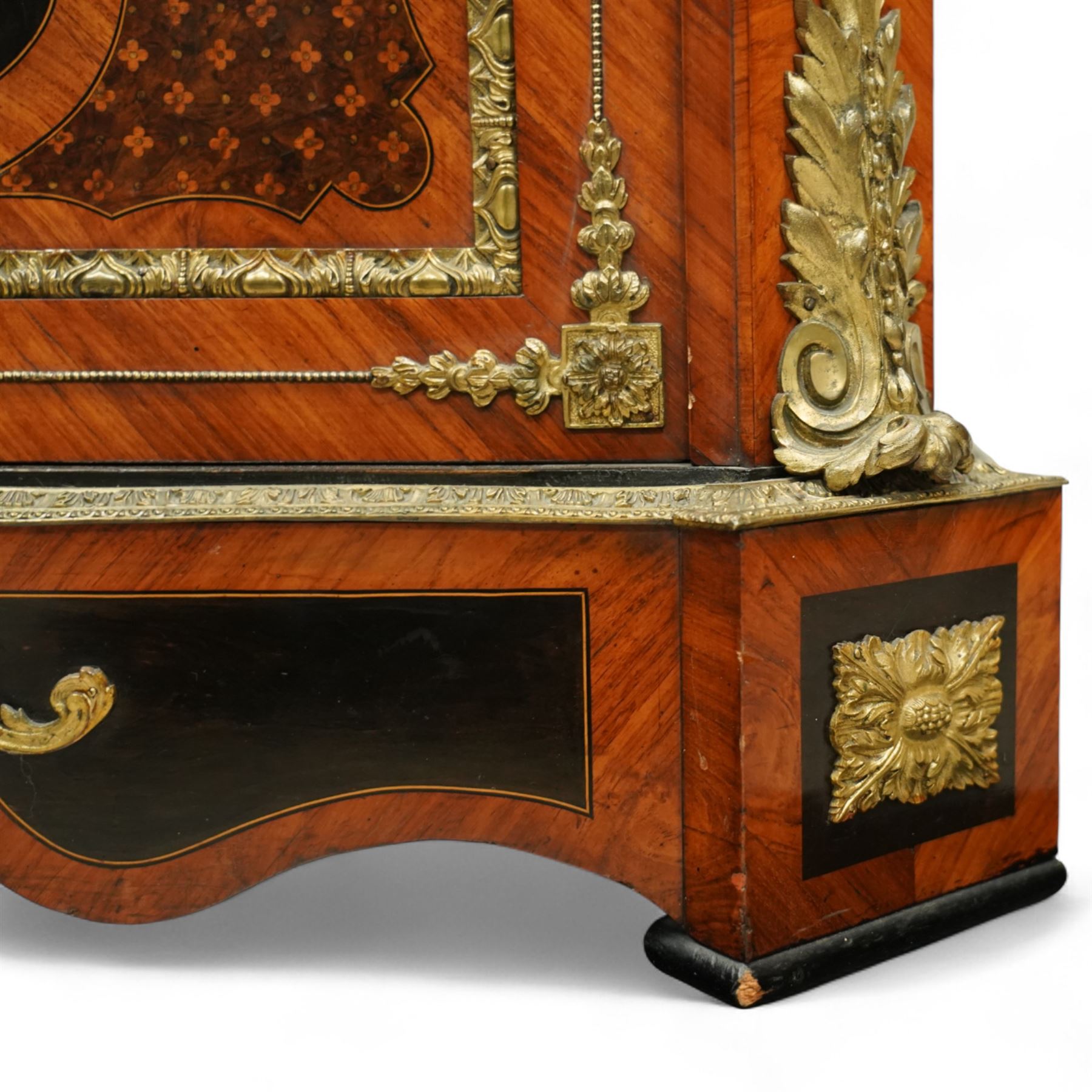 Late Victorian floral marquetry and ormolu mounted side cabinet, with white marble top above a frieze of floral inlay, single cupboard door revealing a shelved interior, with central floral bouquet panel within gilt-bronze border, flanked by gilt metal mounts of female masks and scrolls, on shaped plinth base