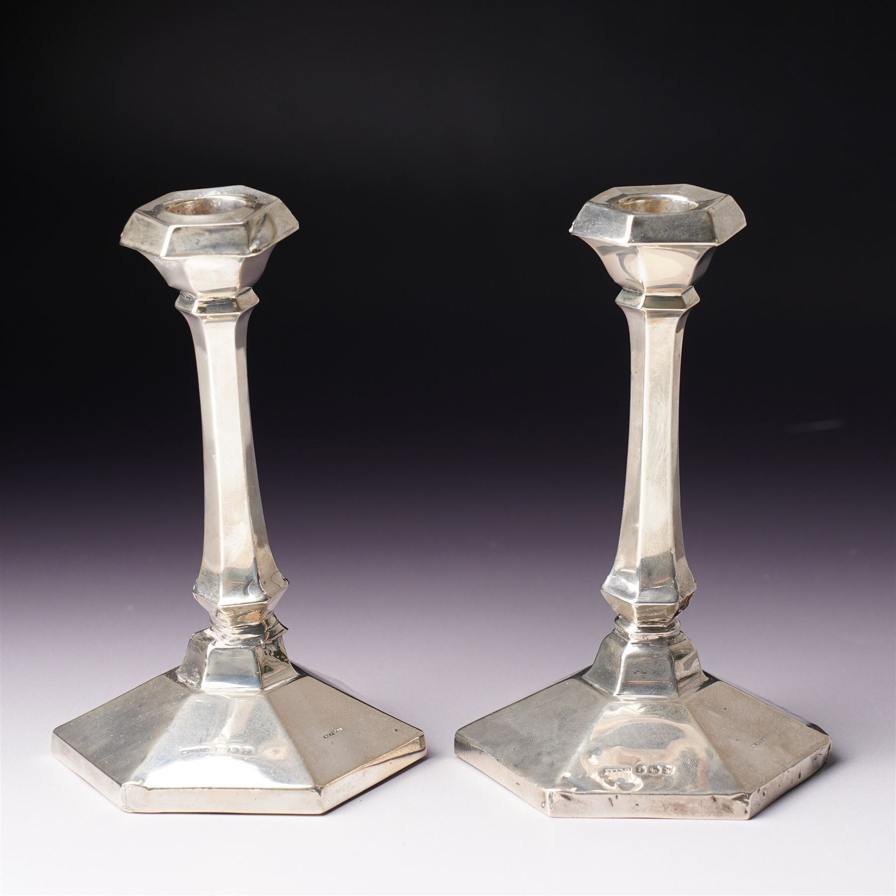 Pair of Art Deco design silver candlesticks with panel sided stems on hexagonal bases H15cm Birmingham 1923 Maker W G Sothers Ltd