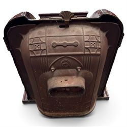 Deville & Cie of Charleville - early 20th century Art Deco cast iron and burgundy enamel 'Cristal' wood burning stove, hinged vent over lattice glazed door and ash drawer, on shaped geometric base, circa 1920