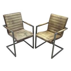 Pair of contemporary industrial style armchairs, each featuring a squared steel cantilever frame with upholstered arms, the seat and back finished in channel-stitched distressed tan faux leather