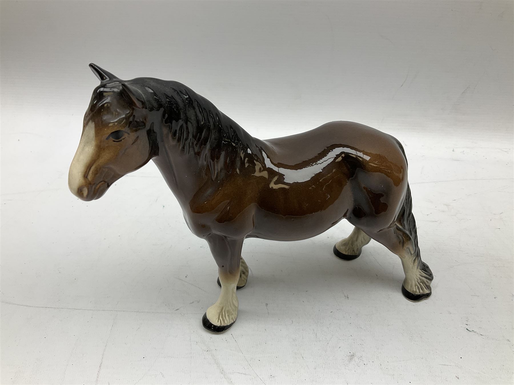 Seven Beswick figures of horses, including Connemara pony in grey no.1641, Arab in bay no.1265, large foal in grey no.947 etc, together with a Goebel figure of a horse (8)
