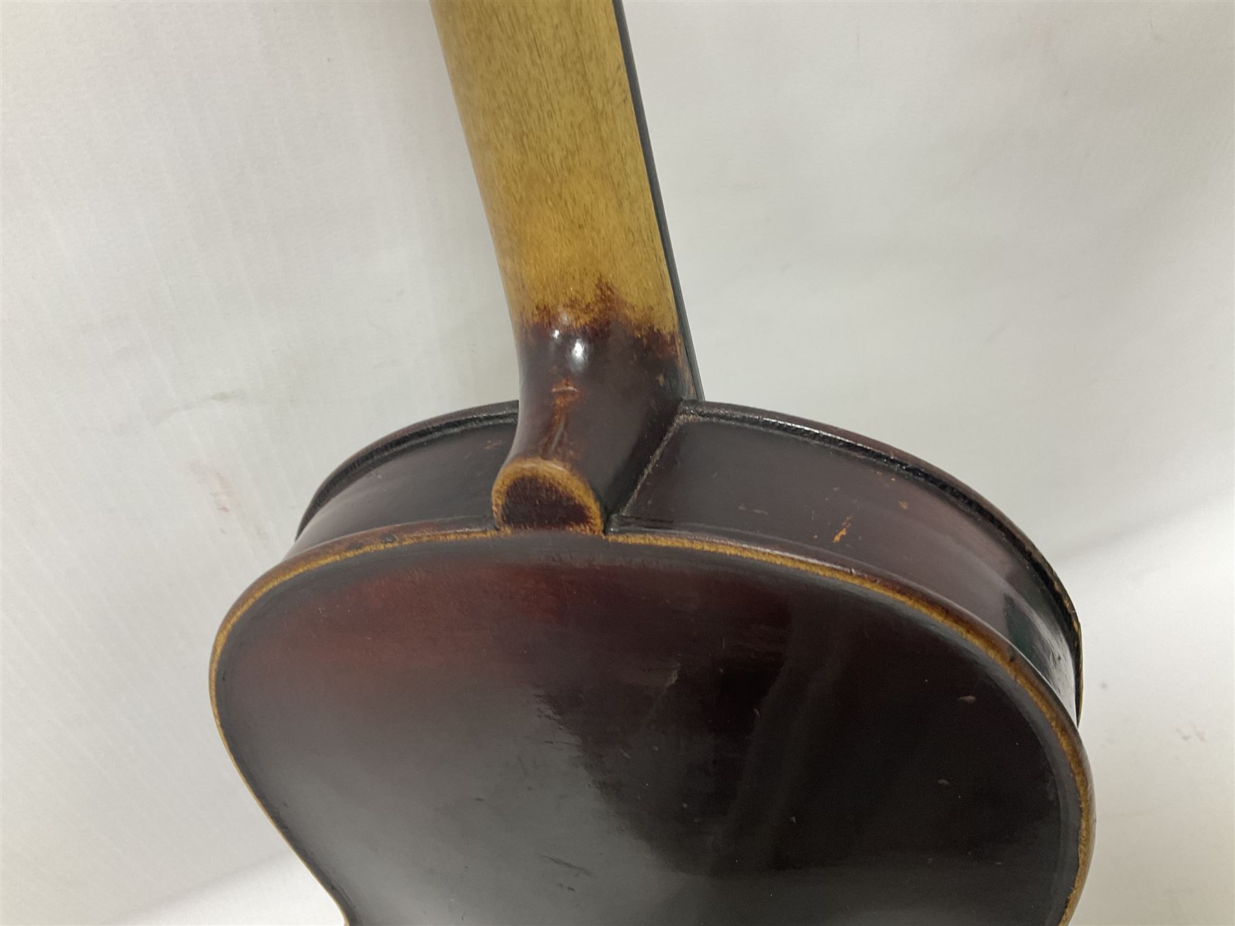 Neuner & Hornstiner early 20th century half size violin c1900, two piece maple back and ribs with a spruce top in a later ridged carrying case, no bow Length 57cm