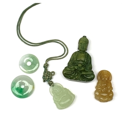 A jade pendant modelled as a hotai, H3.5cm, two small jade pi discs, a further carved pendant modelled as a buddah, and a carved soapsone figure of similar form. 