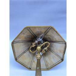 In the manner of Tiffany & Co, early 20th century gilt bronze Adam pattern table lamp, circa 1910, the circular spreading base decorated with flower heads and beaded bands, stiff leaves and husks, leading to a reeded column detailed with stiff leaves and swags, supporting a pierced octagonal shade, with original fittings, stamped beneath Tiffany Studios New York 539, overall H44.5cm


