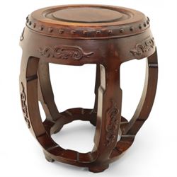 Pair of early 20th century Oriental hardwood barrel seats, of drum form with shaped apron and pierced panels, carved with stylised scrollwork and studded detail to the top
