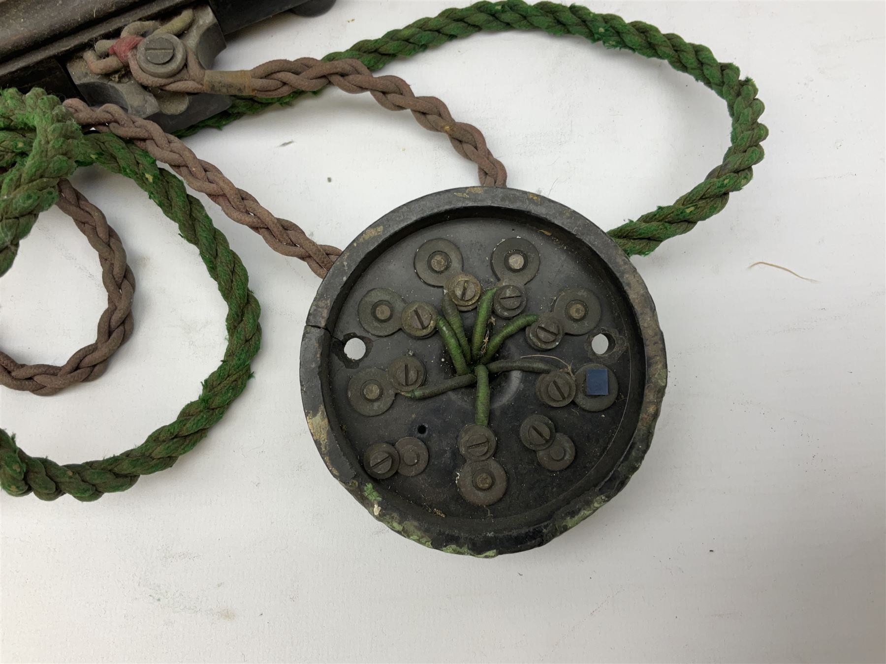 Early 20th century Danish desk telephone inscribed The Ericsson Bell Telephone Co. Glasgow to one side and Aktieselskabet Electrisk Bureau Kristiansand to the other, ebonised wooden top with handset on brass cradle. black japanned tin centre section bearing Hull Corporation Telephones Department crest, side cranking handle and ebonised wooden base H30cm  