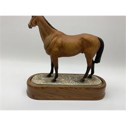 A Royal Worcester limited edition figure, Arkle, owned by the Duchess of Westminster, modelled by Doris Lindner, on wooden base, H27cm. 