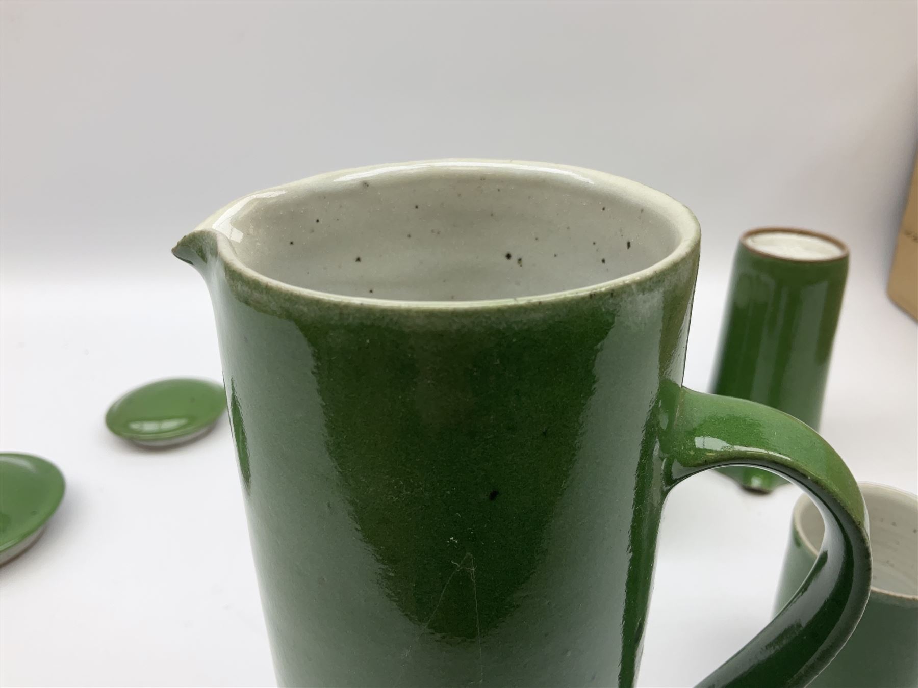 Rupert Spira (born 1960) stoneware coffee service decorated with vivid green glaze, comprising coffee pot, three cups, lidded sucrier and milk jug, all having impressed RS marks beneath, tallest H25cm