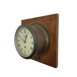 20th century - Brass cased ships bulkhead clock with an Astral movement.5” dial mounted on a square oak board