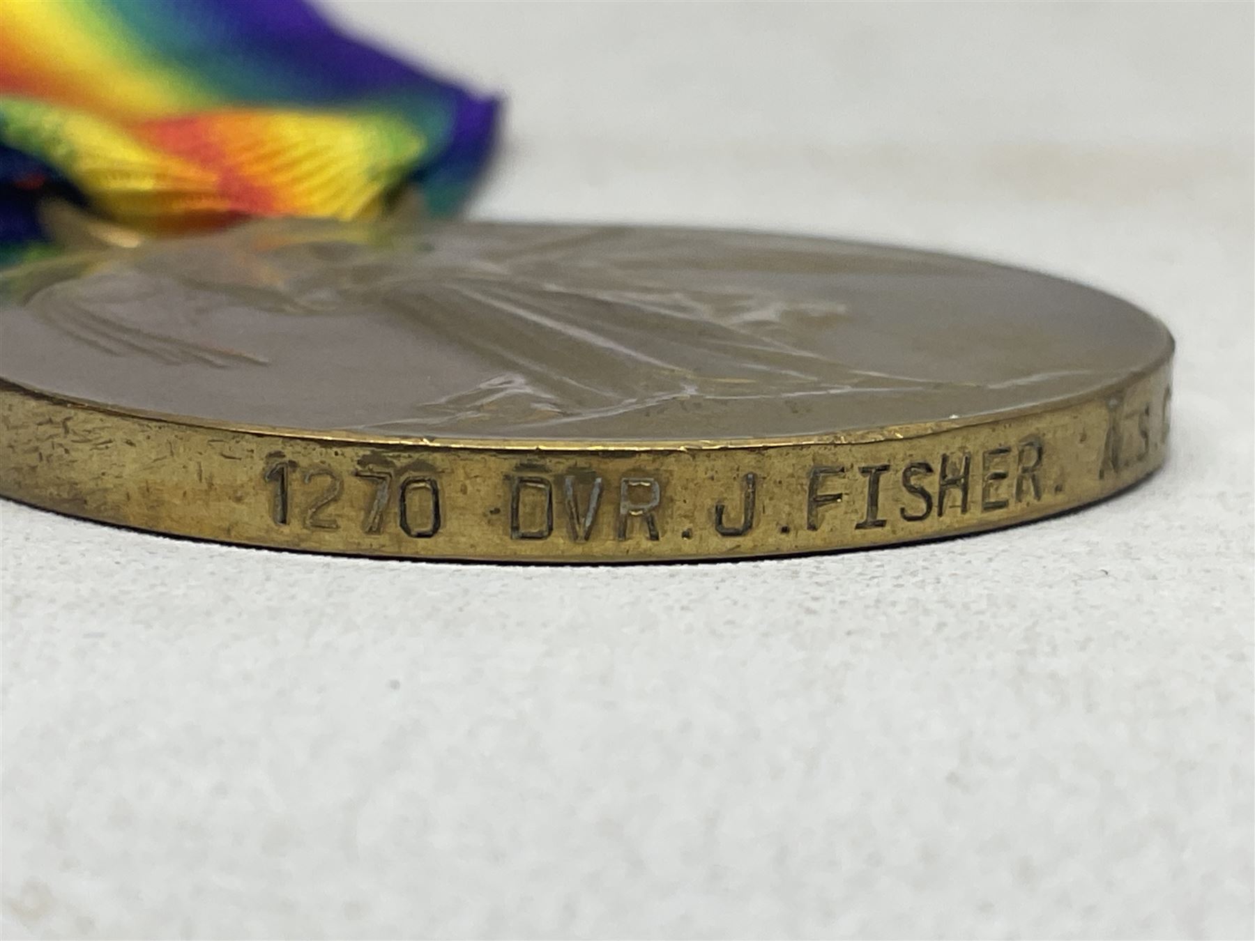 WW1 group of three medals comprising British War Medal, 1914-15 Star and Victory Medal awarded to 1270 Dvr. J. Fisher A.S.C.; and Territorial Efficiency Medal to T4-214571 Dvr. J. Fisher R.A.S.C.; all with ribbons (4)