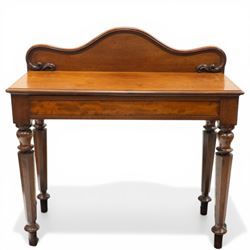 Victorian mahogany side table, raised back with scroll-moulded edge over a rectangular top...