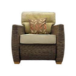 Contemporary two seat rattan conservatory sofa with loose cushions, and pair of matching armchairs, with upholstered seat and back cushions in a beige fabric, curved arms and front complete with scatter cushions 

Chairs (H 92cm, W 75cm, D 84cm)
Sofa (H 92cm, W 130cm, D 84cm)