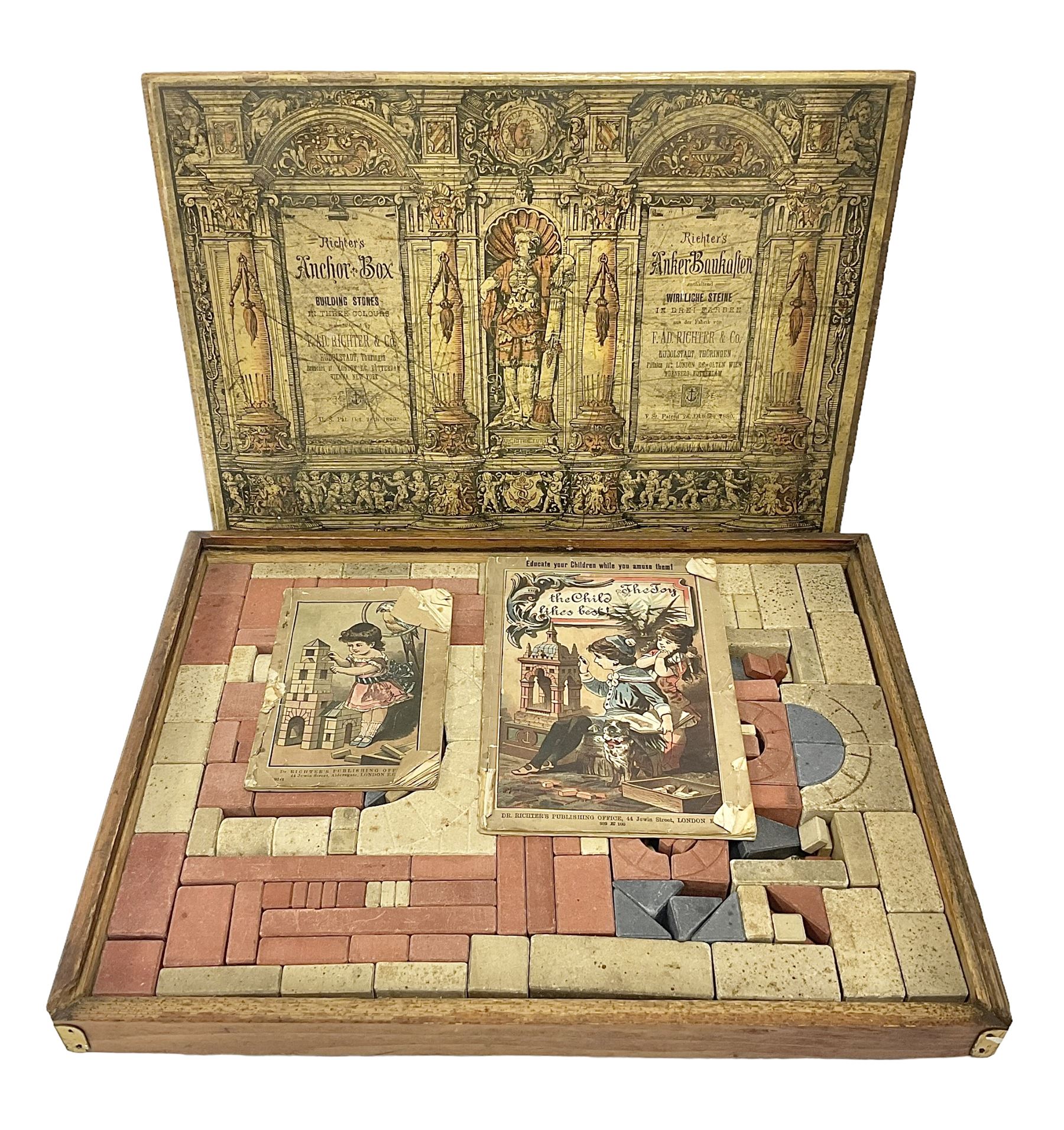 Richters 1880s Anchor Box Stone Block Building set, in original wooden box with sliding lid and paper label; with two instruction booklets, circa 1880-1900s
