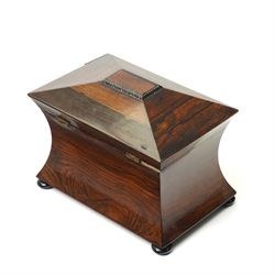 Early 19th century rosewood tea caddy of waisted sarcophagus form, twin compartments, on compressed bun feet, brass keyplate, H17cm W22cm 