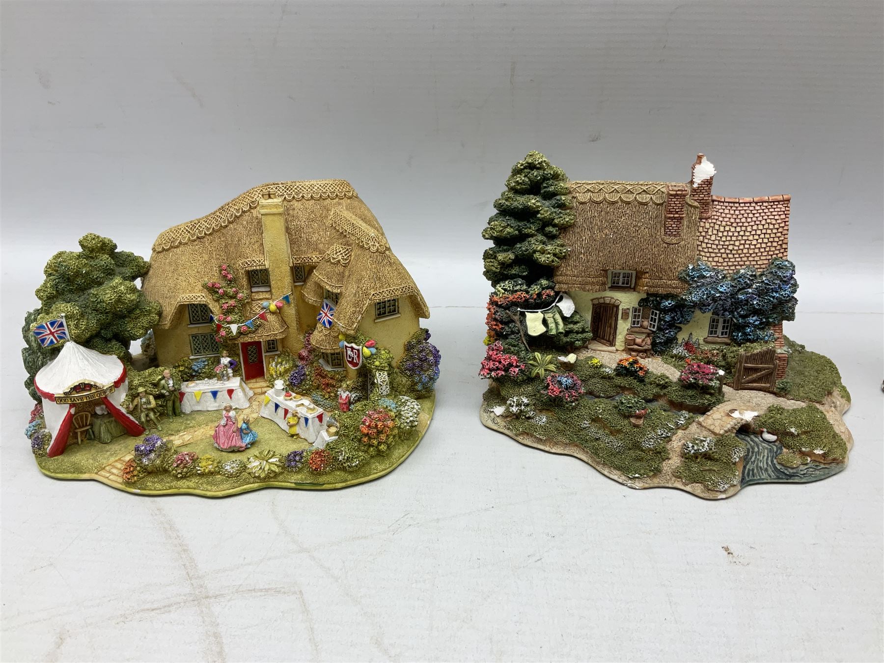 Sixteen Lilliput Lanes, to include The Golden Jubilee, Round Tower - Windsor Castle, Castle of the Golden Chalice, Travellers Rest, with box and deed,  Summer Days, Sunshine Creek, Writing with Lewis Carol, with box and deed,  etc 