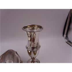 Early 20th century silver vase, of waisted form, with reed and bow border, upon knopped stem and filled circular stepped foot, hallmarked William Comyns & Sons, London 1911, H15cm, together with pair of Indian silver trumpet vases, with chased and embossed floral decoration, a pair of silver mounted clothes brushes, hallmarked Deakin & Francis Ltd, Birmingham 1946  and a 1920s silver mounted hairbrush, hallmarked W J Myatt & Co, Birmingham 1922