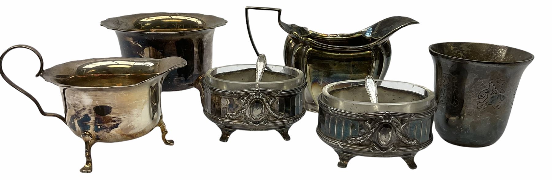 Two Georgian silver toddy ladles with baleen twist handles, (neither hallmarked), one with inset coin to bowl, together with a group of silver plate including cruet stand enclosing two glass bottles with stoppers, shaker and preserve pot with spoon, pair open salts with glass liners, etc. 