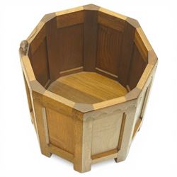 Mouseman - octagonal oak planter or log bin, with contrasting fumed oak panels, penny moulded top, with a cylindrical removable steel bucket, on eight short legs, with carved mouse signature, by the workshop of Robert Thompson of Kilburn, with 1997 original purchase receipt
