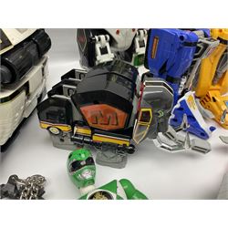 Collection of early 90s Mighty Morphin’ Power Rangers Zords, figures and accessories. Titanus the Carrier Zord, marked Bandai 1991; Green Dragonzord, incomplete; 1994 White Tigerzord with original instruction manual; 1993 Triceratops Dinozord, Mastodon Dinozord and Sabertooth Tiger Dinozord, Pterodactyl Dinozord, missing guns; with 1993 Power Morpher and original Power Coins, with further related figures, accessories and weapons