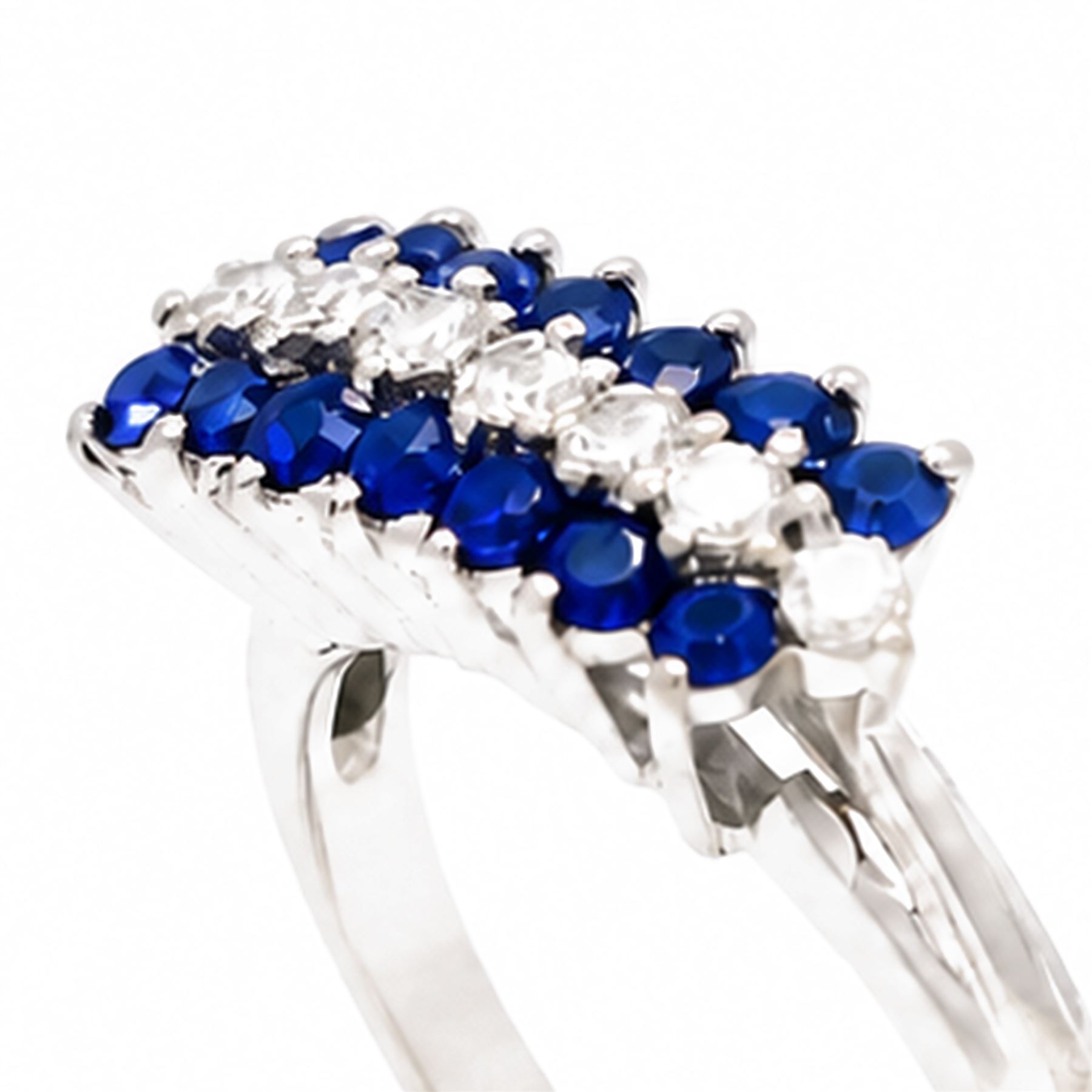 White gold diamond and sapphire three row ring, eight round brilliant cut diamonds, set between two rows of round cut sapphires, stamped 18ct, total diamond weight approx 0.30 carat